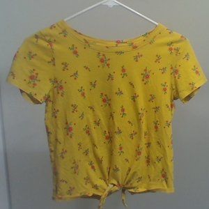 yellow tied shirt with flowers